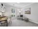 Home office with built-in bookshelves and a bright window at 255 Broken Lance Pl, Johns Creek, GA 30022