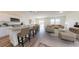 Spacious open-concept living area with a modern kitchen, a dining space, and a comfortable living room at 55 Bandimere Pkwy, Dallas, GA 30157