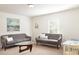 Comfortable living room with modern sofas, a unique coffee table, and a serene atmosphere at 55 Bandimere Pkwy, Dallas, GA 30157