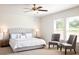 Serene main bedroom featuring a luxurious bed, stylish bedside tables, and plenty of natural light at 55 Bandimere Pkwy, Dallas, GA 30157