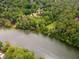 Aerial view of the property highlighting the home's proximity to a river and lush surroundings at 8470 Lazy Oaks Ct, Atlanta, GA 30350