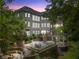 Beautiful backyard featuring a multi-level patio, lush greenery, and an expansive outdoor space at 8470 Lazy Oaks Ct, Atlanta, GA 30350