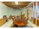 Basement featuring a large conference table with brown leather chairs at 8470 Lazy Oaks Ct, Atlanta, GA 30350