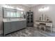 Bright bathroom with double sink vanity, decorative mirror, and marble flooring at 8470 Lazy Oaks Ct, Atlanta, GA 30350