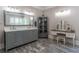 Bathroom featuring a vanity with white countertop and marble floors with a built-in toiletry display at 8470 Lazy Oaks Ct, Atlanta, GA 30350