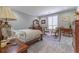 Bedroom featuring carpet, natural light, crown molding, and classic-style furniture at 8470 Lazy Oaks Ct, Atlanta, GA 30350