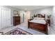 Elegant bedroom featuring carpet, gray walls, and decorative furnishings at 8470 Lazy Oaks Ct, Atlanta, GA 30350