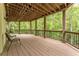 This lovely covered deck features natural views and railing detail, perfect for enjoying the outdoors at 8470 Lazy Oaks Ct, Atlanta, GA 30350