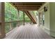 This lovely covered deck features natural views and railing detail, perfect for enjoying the outdoors at 8470 Lazy Oaks Ct, Atlanta, GA 30350