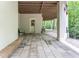 This expansive covered patio is perfect for enjoying the outdoors and watching the scenic forest area at 8470 Lazy Oaks Ct, Atlanta, GA 30350