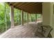This expansive covered patio is perfect for enjoying the outdoors and watching the scenic forest area at 8470 Lazy Oaks Ct, Atlanta, GA 30350