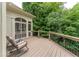 Enjoy peaceful views from this screened deck, perfect for outdoor dining or lounging in a serene setting at 8470 Lazy Oaks Ct, Atlanta, GA 30350