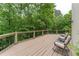 Inviting outdoor deck with a wooded view perfect for relaxing and enjoying the surrounding nature at 8470 Lazy Oaks Ct, Atlanta, GA 30350