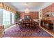 Formal dining room with hardwood floors, ornate details, and a large bay window at 8470 Lazy Oaks Ct, Atlanta, GA 30350