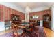 Elegant dining room with crystal chandelier, classic furnishings, and hardwood flooring at 8470 Lazy Oaks Ct, Atlanta, GA 30350