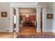 Dining room featuring hardwood floors, traditional furnishings, and natural light at 8470 Lazy Oaks Ct, Atlanta, GA 30350