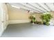 Spacious garage with epoxy floor, natural light, storage cabinets and plant accents at 8470 Lazy Oaks Ct, Atlanta, GA 30350