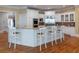 Kitchen featuring a granite countertop island with chairs at 8470 Lazy Oaks Ct, Atlanta, GA 30350