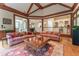 Open-concept living area showcasing hardwood floors, large windows, and views to other rooms at 8470 Lazy Oaks Ct, Atlanta, GA 30350