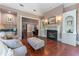 Spacious living room with hardwood floors, fireplace, and built-in bookshelves at 8470 Lazy Oaks Ct, Atlanta, GA 30350