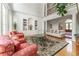 Living room featuring a balcony overlooking the entry hall at 8470 Lazy Oaks Ct, Atlanta, GA 30350