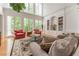Bright living room with tall windows and hardwood floors at 8470 Lazy Oaks Ct, Atlanta, GA 30350
