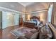 Elegant main bedroom suite showcasing vaulted ceiling, seating area, and french doors at 8470 Lazy Oaks Ct, Atlanta, GA 30350