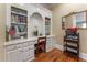 Office with built-in desk, storage cabinets, and shelving, creating a functional workspace at 8470 Lazy Oaks Ct, Atlanta, GA 30350