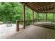 Inviting outdoor patio blending seamlessly with a wooded backdrop, perfect for relaxation and enjoying the nature at 8470 Lazy Oaks Ct, Atlanta, GA 30350