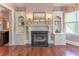 Sitting room features a fireplace flanked by custom shelves, offering a cozy spot for relaxation at 8470 Lazy Oaks Ct, Atlanta, GA 30350