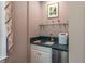 Convenient wet bar featuring a mini fridge, stainless steel sink, and ample counter space at 8470 Lazy Oaks Ct, Atlanta, GA 30350
