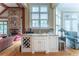 Bright wet bar with wine storage, sink and granite countertops, connects to living space at 8470 Lazy Oaks Ct, Atlanta, GA 30350