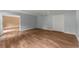 Finished basement with laminate flooring, neutral paint, and closet space at 1713 Dudley Dr, Woodstock, GA 30188