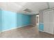 Basement room featuring tile flooring and colorful accent walls with an adjacent storage closet at 1713 Dudley Dr, Woodstock, GA 30188