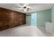 Finished basement features wood-paneled wall, tile flooring, and attached sink and storage at 1713 Dudley Dr, Woodstock, GA 30188