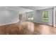 Finished basement with wood-look laminate flooring and open doorway to other parts of the basement at 1713 Dudley Dr, Woodstock, GA 30188