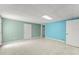 Large finished basement area featuring tile flooring and neutral and accent walls with white doors at 1713 Dudley Dr, Woodstock, GA 30188