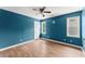 Comfortable bedroom featuring wood floors, a ceiling fan, and good light at 1713 Dudley Dr, Woodstock, GA 30188