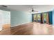 Comfortable bedroom with hardwood floors, modern ceiling fan, and plenty of natural light at 1713 Dudley Dr, Woodstock, GA 30188