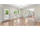 Bright dining room with tile flooring, chandelier, and access to a sunroom at 1713 Dudley Dr, Woodstock, GA 30188