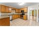 Kitchen with tile floors, granite countertops, stainless steel appliances, and ample cabinet space at 1713 Dudley Dr, Woodstock, GA 30188