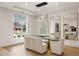 Bright dining room with a glass table, plush seating, and modern mirrors to enhance the space at 185 Pebble Trl, Alpharetta, GA 30009