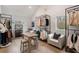 The dressing room includes display racks, a work table, and a comfortable seating area at 185 Pebble Trl, Alpharetta, GA 30009