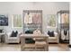 A tidy dressing room with clothing racks and comfortable seating beneath natural lighting at 185 Pebble Trl, Alpharetta, GA 30009