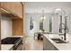 Contemporary kitchen with modern appliances, sleek cabinetry, and an eat-in area with natural light at 185 Pebble Trl, Alpharetta, GA 30009