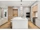 Gourmet kitchen featuring stone counters, stainless steel appliances, and a large island at 185 Pebble Trl, Alpharetta, GA 30009