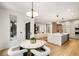 Spacious open floor plan with kitchen, dining area, and living room creating an ideal entertaining space at 185 Pebble Trl, Alpharetta, GA 30009
