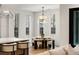 Eat-in kitchen nook features stylish seating, contemporary lighting, and bright natural light at 185 Pebble Trl, Alpharetta, GA 30009