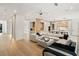 Open concept living room boasts modern decor, wood floors, and an airy atmosphere at 185 Pebble Trl, Alpharetta, GA 30009