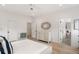 Airy main bedroom featuring stylish furniture and an abundance of natural light at 185 Pebble Trl, Alpharetta, GA 30009